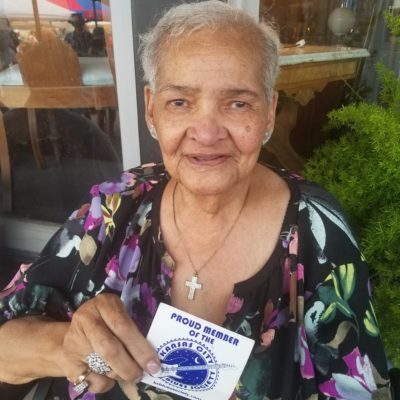 "Queen" Marvine McKeithen holding her Kansas City Blues Society membership card