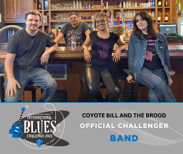 Coyote Bill and The Brood sitting in a bar smiling