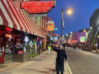 Mark Montgomery waving on Beale Street outside the Kings Palace