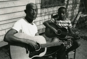 Pinkney (Pink) Anderson and his son play guitar together