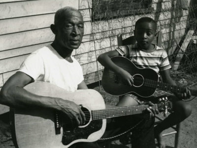 Pinkney (Pink) Anderson and his son play guitar together