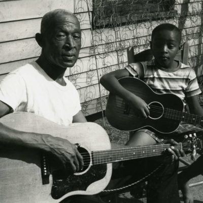 Pinkney (Pink) Anderson and his son play guitar together