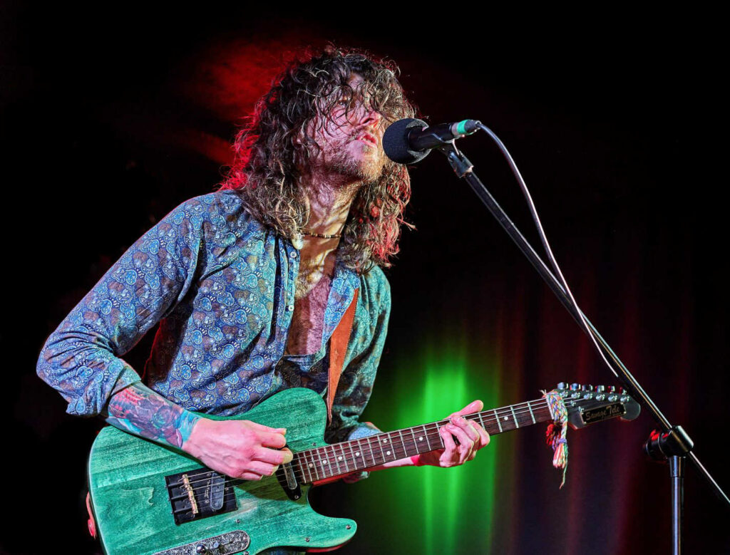 Dom Martin, Irish blues musician, performing with his green telecaster guitar